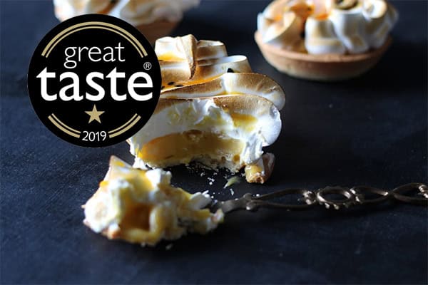Passion fruit meringue tart with toasted meringue in London patisserie