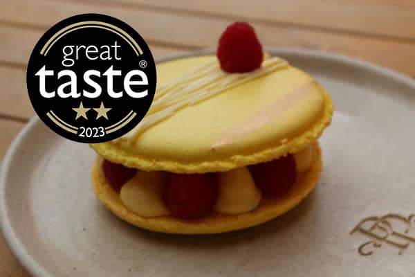 Large passion fruit and raspberry macaron handmade in London patisserie